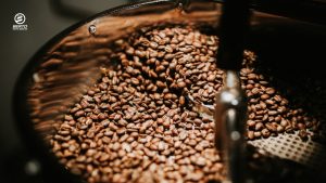 Coffee beans roasting in a hot air roaster.