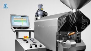 A coffee roaster monitoring the coffee roasting curve with roasting software.