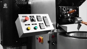 Berto Essential Air coffee roaster control panel with adjustments for roasting variables and a safety emergency stop button.